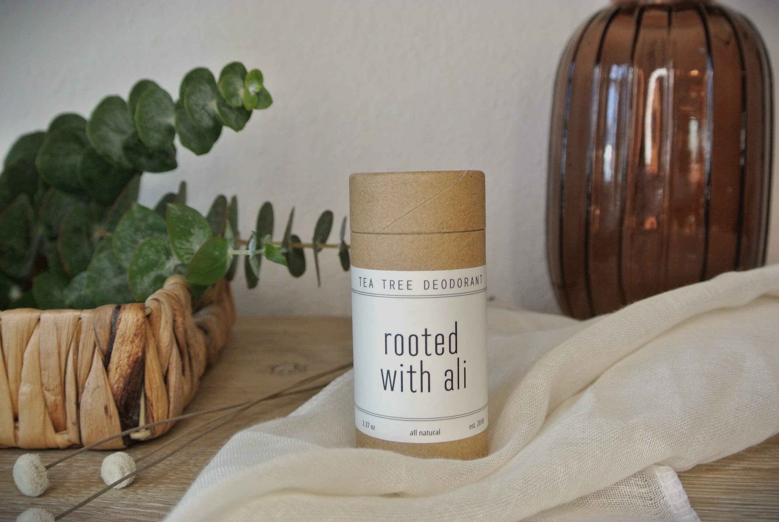 tea tree deodorant on table