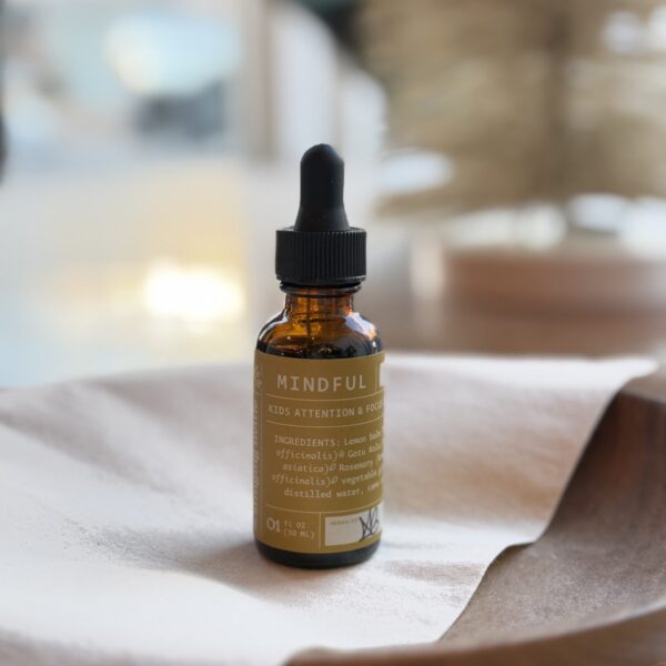 mindful kids tincture on wooden bowl