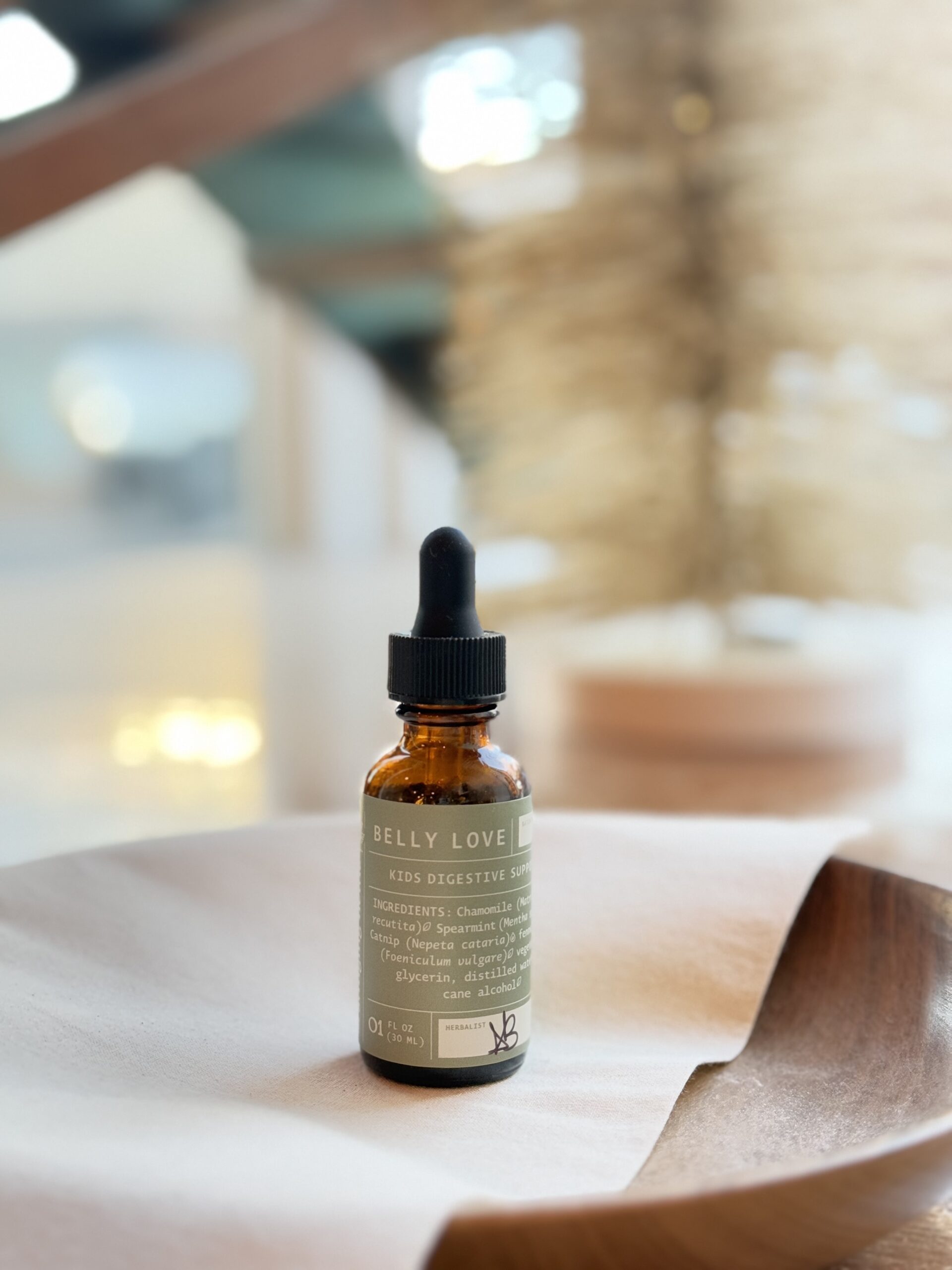 belly love kids tincture sitting in the bowl